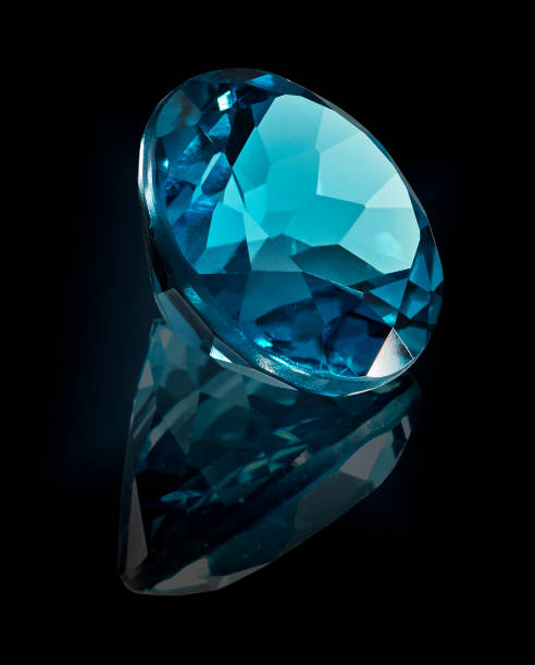 topaz london gem stone isolated on black background.