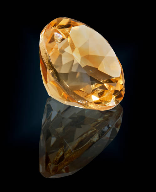 istock citrine gem stone isolated on black background 981760668