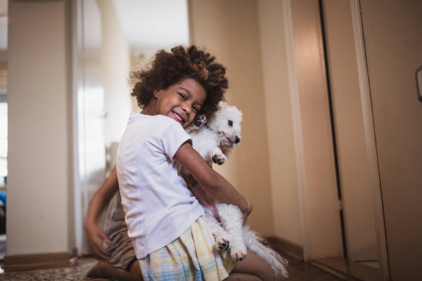 istock Cute, mixed race siblings and their dog 981760718