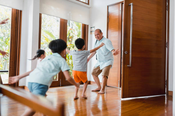 istock Father embracing his children when coming home 981764216