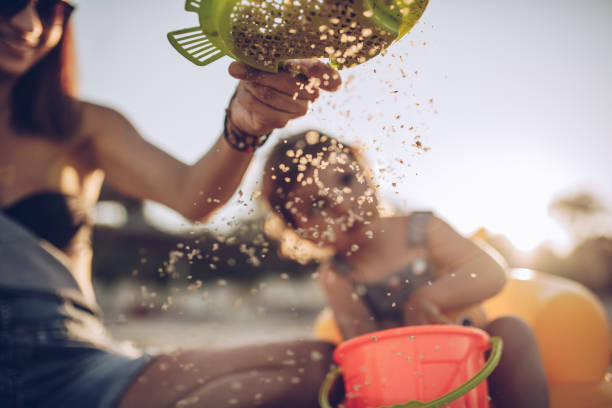 istock Family having fun on the beach 981765020