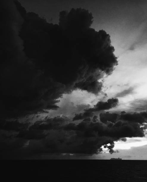 istock cruise ship under storm cloud at sea 981769632