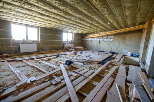 istock Big spacious light empty attic room under construction and renovation. Mansard floor and ceiling insulation with rock wool. Fiberglass insulation staff in wooden frame for cold barrier. 981775494