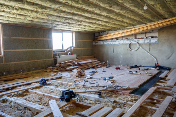 istock Big spacious light empty attic room under construction and renovation. Mansard floor and ceiling insulation with rock wool. Fiberglass insulation staff in wooden frame for cold barrier. 981775764