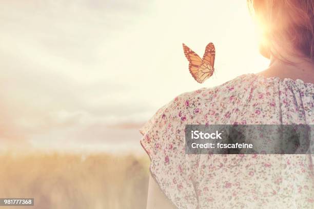 Special Moment Of Meeting Between A Butterfly And A Girl In The Middle Of Nature Stock Photo - Download Image Now