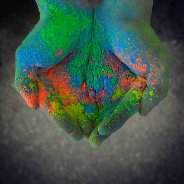 istock Cropped Image Of Cupped Hands With Colorful Powder Paint 981777656