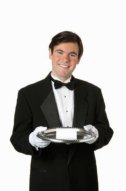 istock man holding silver tray with blank card 98178220