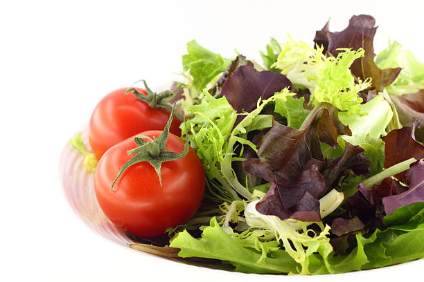 Green salad and tomatoes stock photo