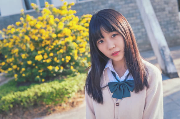 istock Beautiful chinese girl in campus 981783328