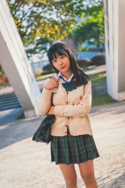 istock Beautiful chinese girl in campus 981784062