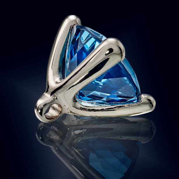 istock topaz london gem stone in golden setting isolated 981785064