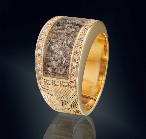 istock Golden ring with gemstone isolated on black background 981788746