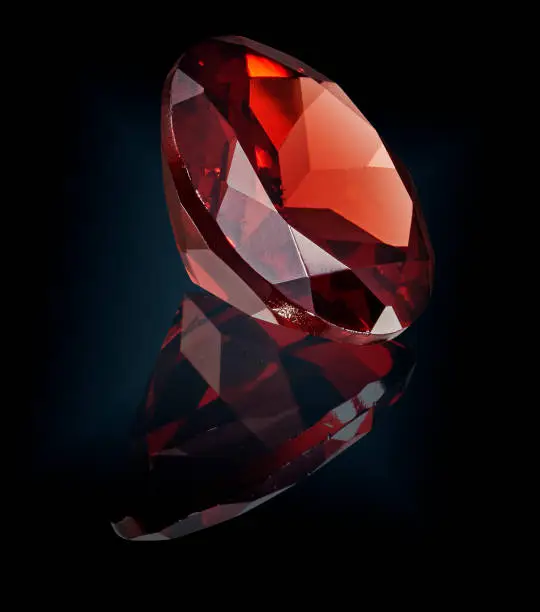 ruby gem stone isolated on black background.