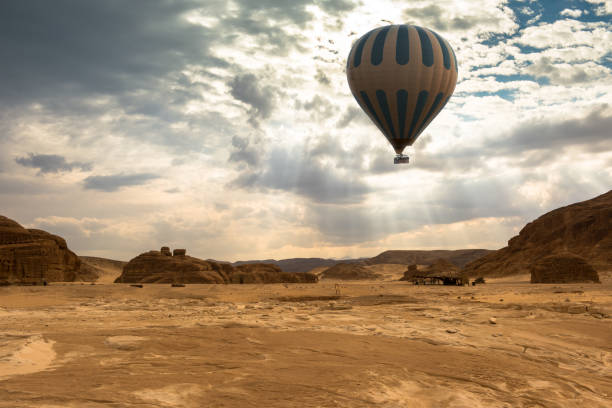istock Hot Air Balloon travel over desert 981795584