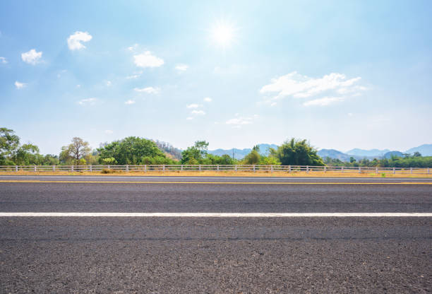 istock Asphalt road and countryside views 981795672