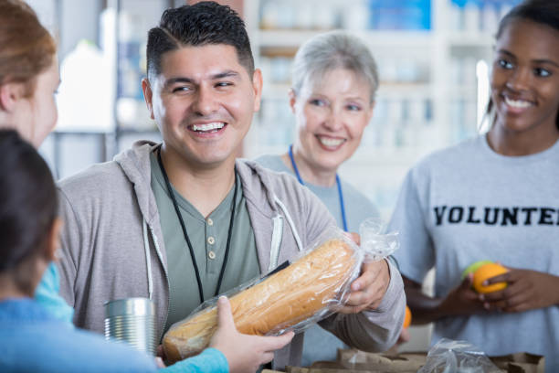 istock People donate food during food drive 981795926