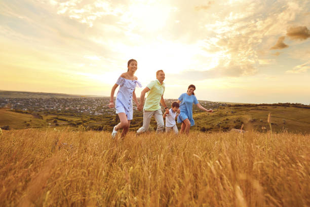 istock Family is running a fun summer nature 981800536