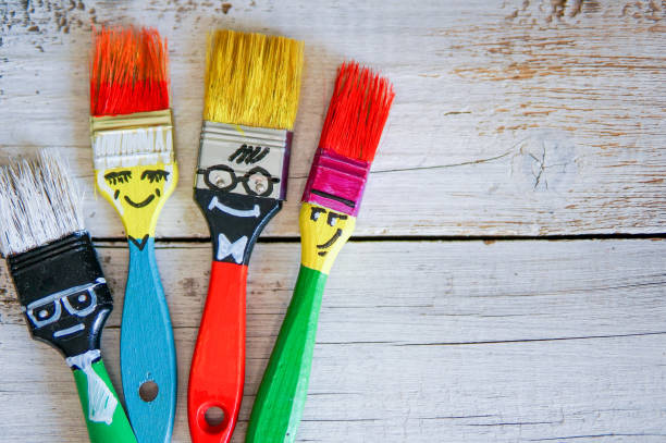 istock Funny brushes friends over grey background 981808222