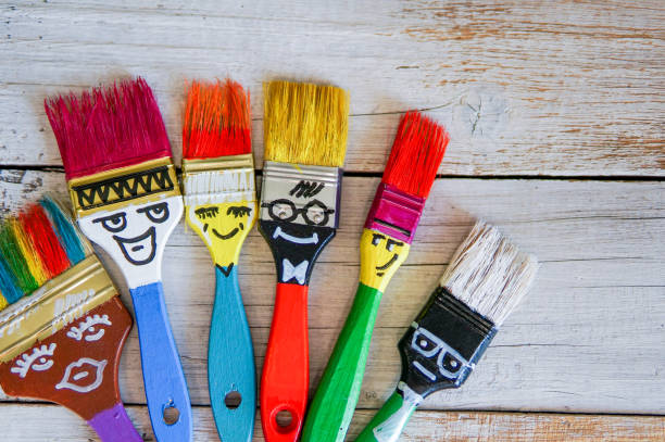 istock Funny brushes friends over grey background 981808422