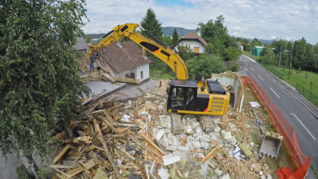TIME LAPSE House being demolished by a large digger