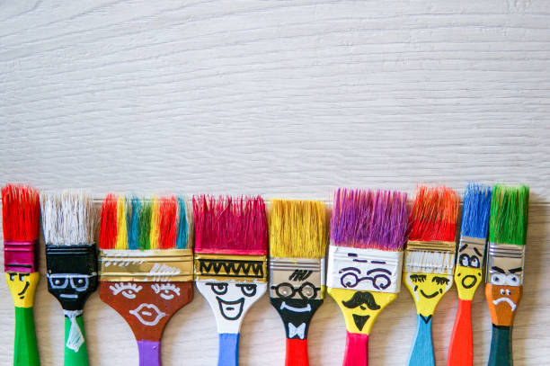 istock Funny brushes friends over grey background 981809074