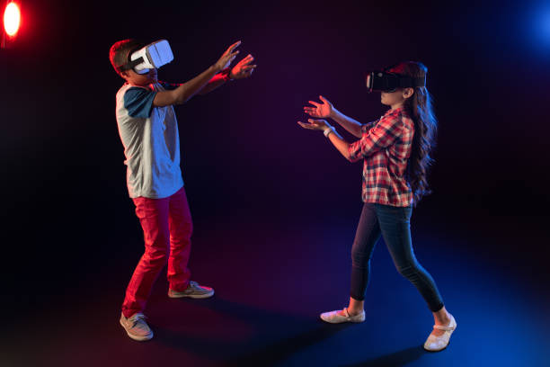 istock Playful best friends playing VR games 981815652