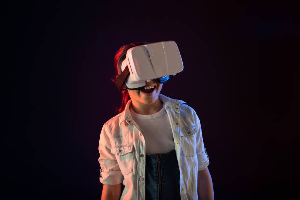 istock Cheerful girl wearing a VR headset 981818630