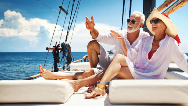 istock Senior couple on a sailing cruise. 981819002