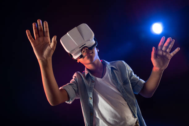 istock Cheerful teenager wearing a modern VR headset 981822686