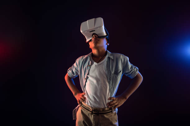 istock Preoccupied teenager wearing a modern VR headset 981822780