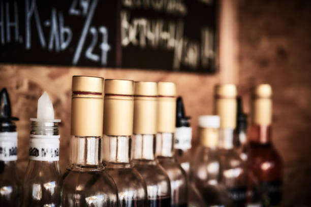 Bottles of herbal and fruit liqueurs in bar