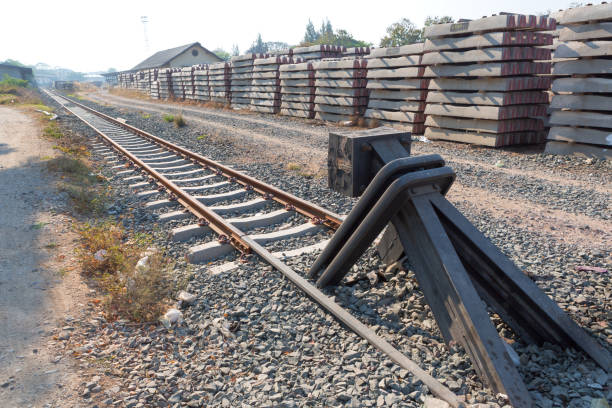 Railway track ending on a barrier Railroad with vanishing point, Railway track ending on a barrier end of the line stock pictures, royalty-free photos & images