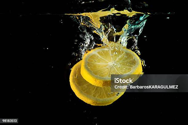 Lemon Time Stock Photo - Download Image Now - Lemon - Fruit, Black Background, Splashing