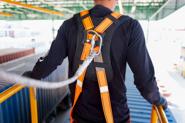 istock Construction worker use safety harness and safety line working on a new construction site project. 981844724