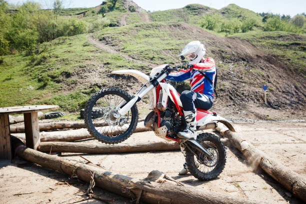 istock Hard enduro motorcycle rider training on an obstacle course 981851632
