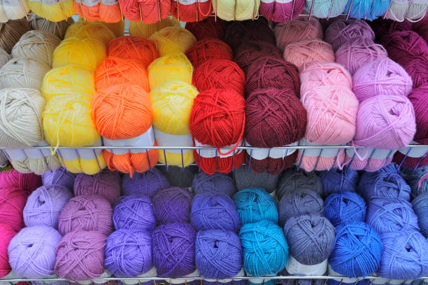Balls of knitting wool on display in a haberdashery store.