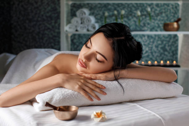 istock young woman in spa salon. 981854258