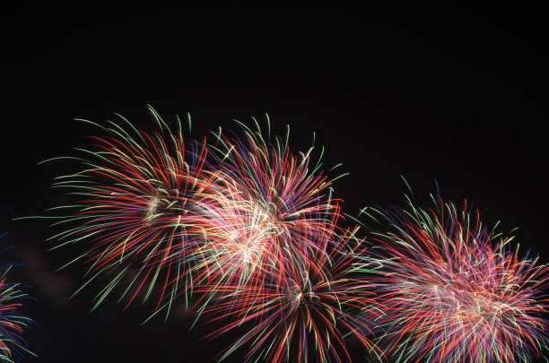 istock colorful fireworks on the black sky background over-water 981862866