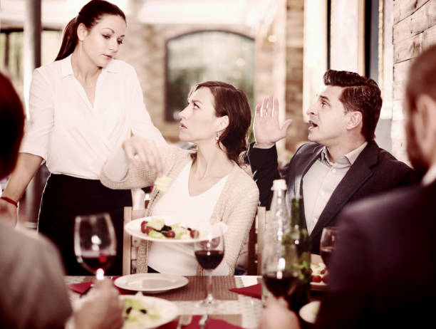 istock Company expressing dissatisfaction with waitress about food 981863574