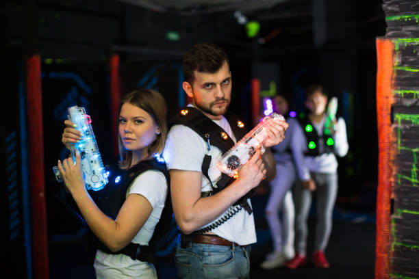 istock Two laser tag players standing back to back 981864258