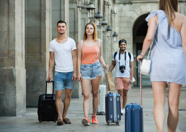 istock Travelers taking walk in town 981865828