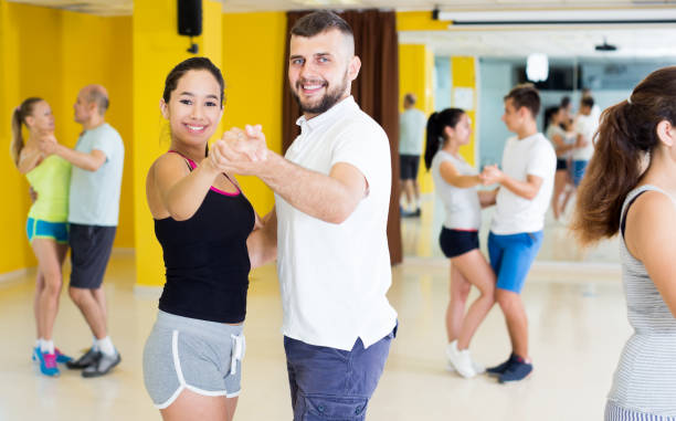 istock Smiling people dancing waltz 981871510