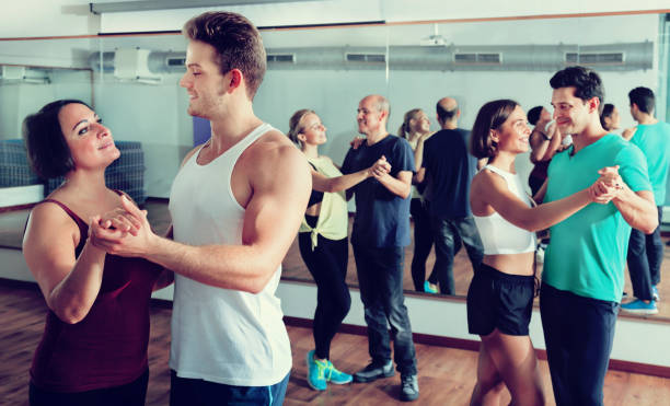 istock Men and women dancing salsa o bachata 981878592