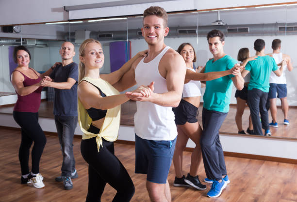istock Smiling adults dancing bachata together 981878678