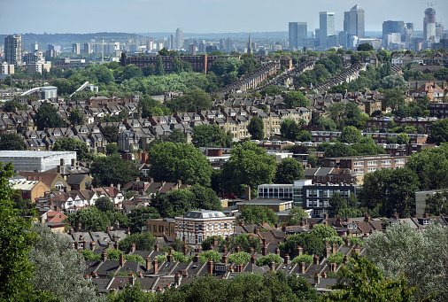 Looking over the rooftops of the London suburb of Crouch End towards canary wharf\nCrouch End is an area of north London, in the London Borough of Haringey north of the Archway, west of Harringay, south of Wood Green and east of Highgate; it lies approximately 5 miles north of the City of London