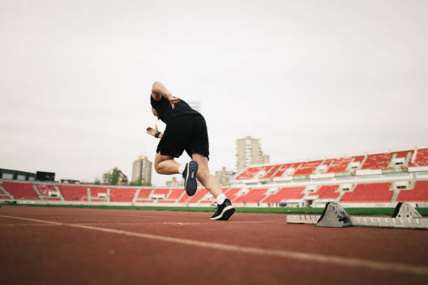 istock Man running on a running truck 981884358