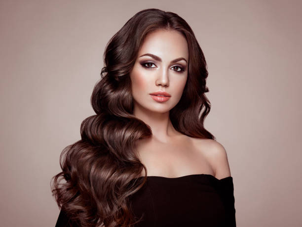 istock Brunette woman with curly hair 981893828