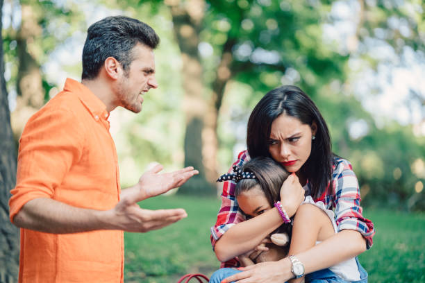 istock Young family with daughter fighting outside 981897612