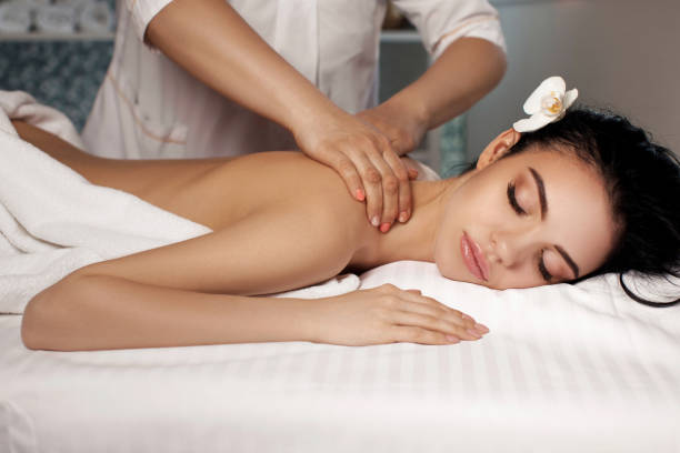 istock Relaxed woman receiving massage 981897990