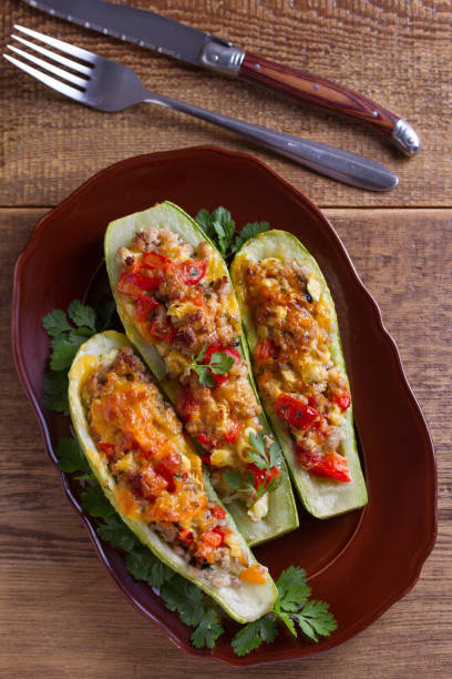 istock Zucchini stuffed with meat, vegetables and cheese. Zucchini boats 981901830